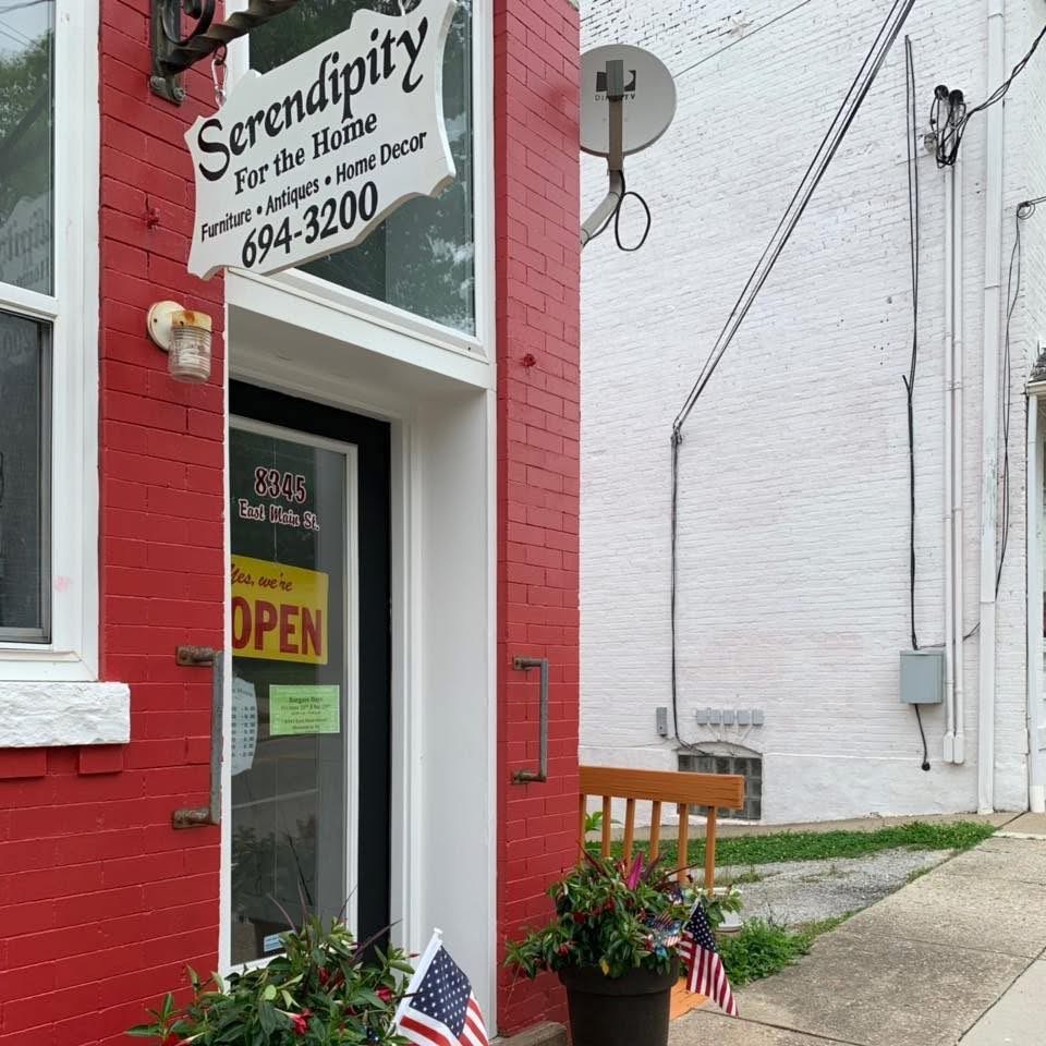 Serendipity’s red-brick storefront, hanging sign and entrance at 8345 East Main Street